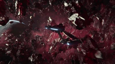 The USS Enterprise pursues NCC-1279 through the rings of Cajitar IV.